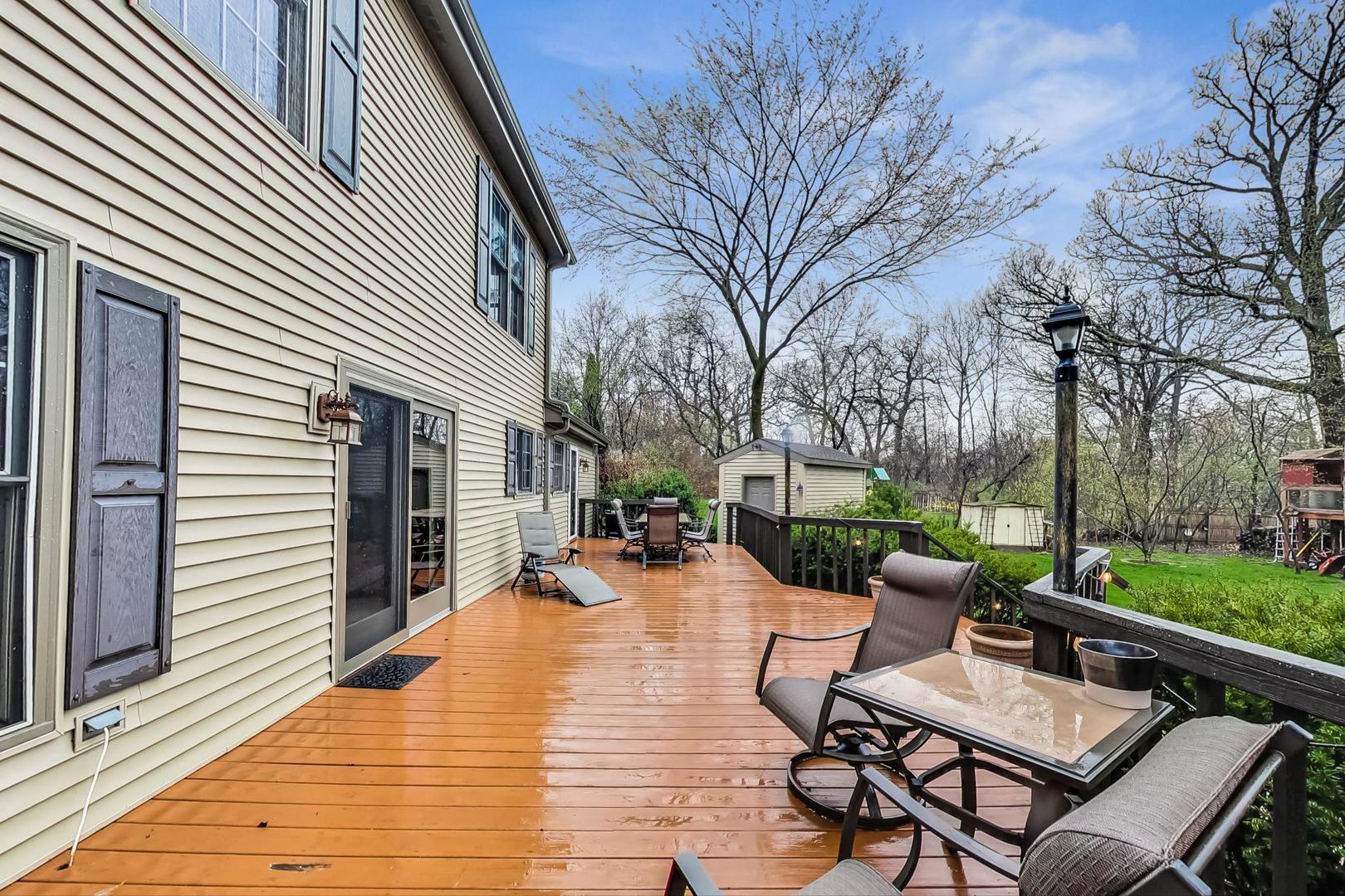 2185 Maplewood Drive Gurnee, IL 60031 - Photo 49 of 65 a view of a patio with couches chairs and a wooden floor