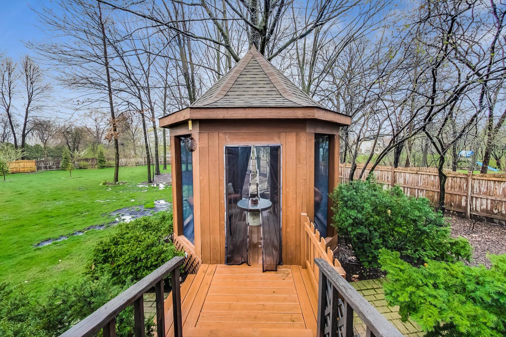 2185 Maplewood Drive Gurnee, IL 60031 - Photo 50 of 65 a front view of a house with garden
