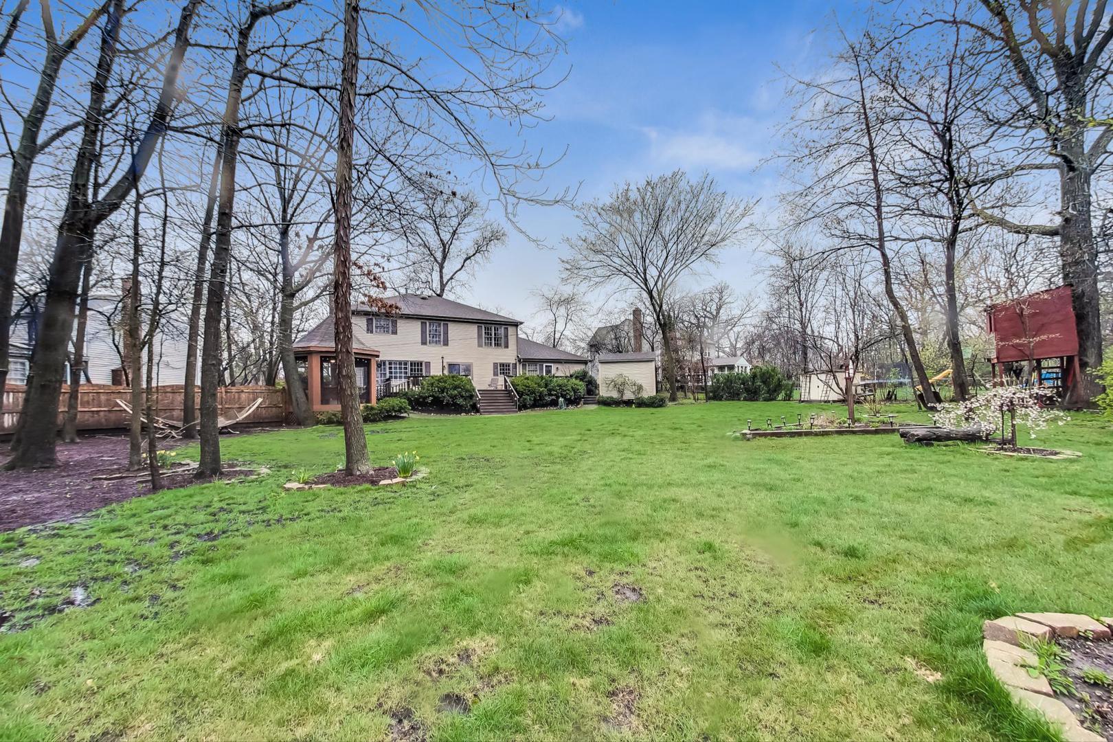 2185 Maplewood Drive Gurnee, IL 60031 - Photo 60 of 65 a view of a yard with a house in the background