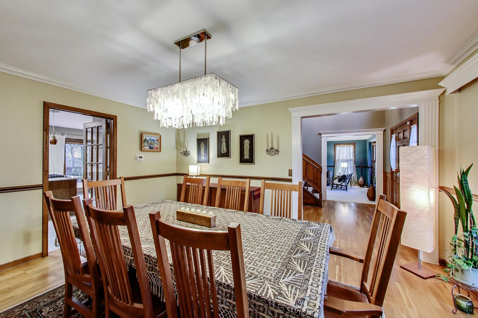 2185 Maplewood Drive Gurnee, IL 60031 - Photo 9 of 65 a view of a dining room with furniture and chandelier