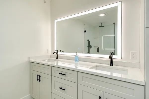 a bathroom with a sink and a mirror