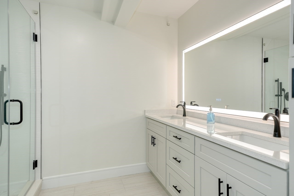 17 School Street, Unit C Hudson, MA 01749 - Photo 12 of 21 a bathroom with a sink and a mirror