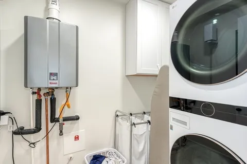a bathroom with a sink a mirror and shower