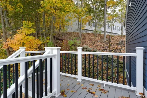 a front view of a residential apartment building with a yard