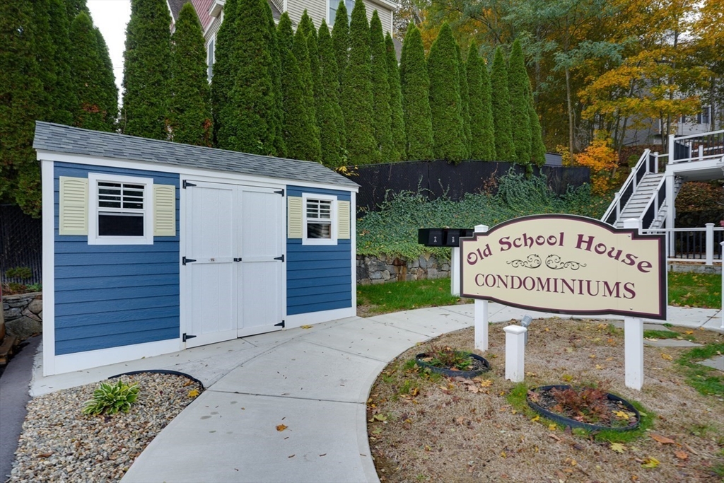 17 School Street, Unit C Hudson, MA 01749 - Photo 20 of 21 a sign that is on the side of the road