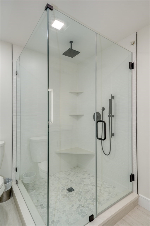 17 School Street, Unit C Hudson, MA 01749 - Photo 10 of 21 a bathroom with a glass shower door