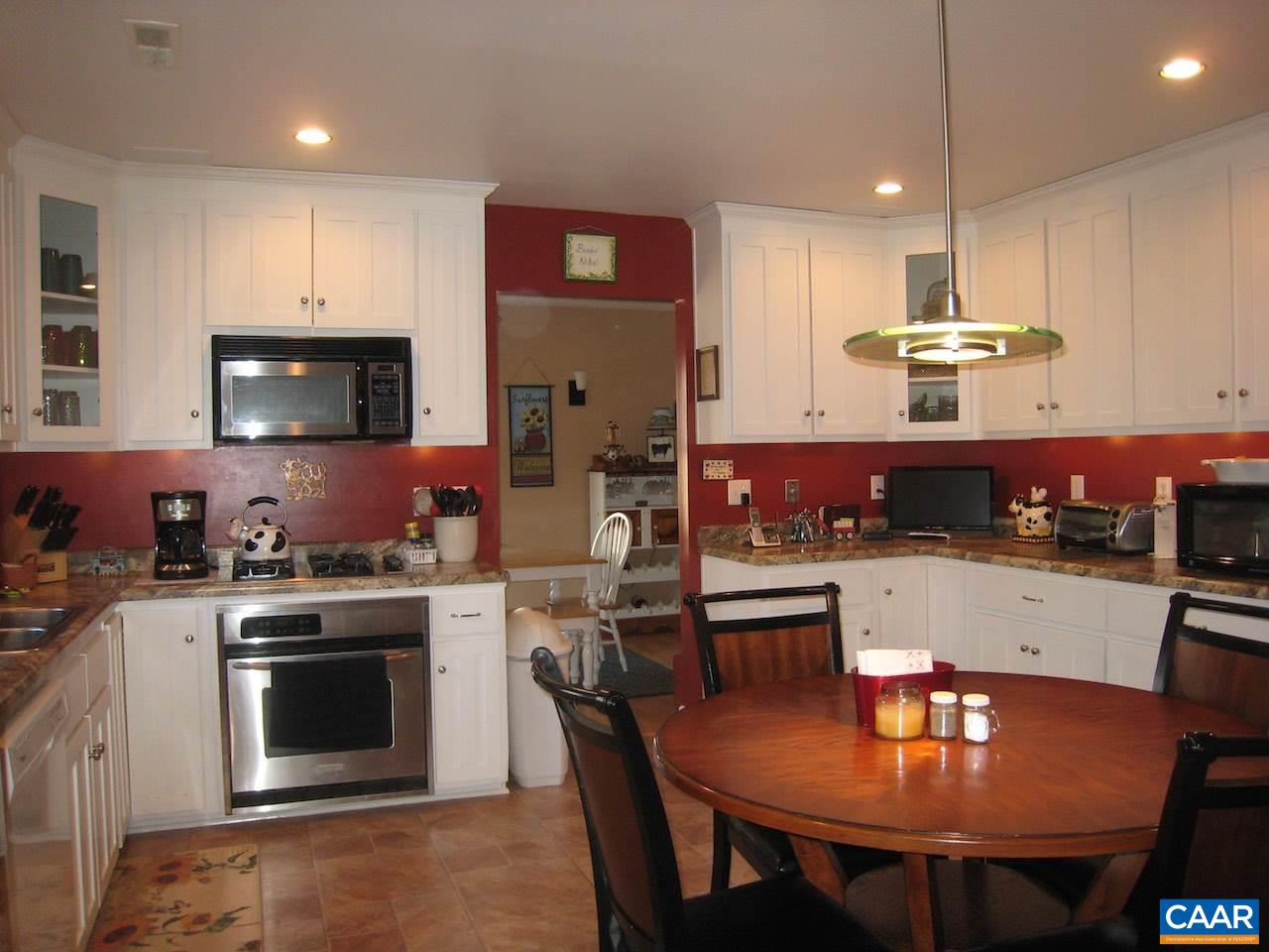 262 Pine Ridge Road Faber, VA 22938 - Photo 24 of 45 a kitchen with stainless steel appliances a stove a sink a microwave a refrigerator and cabinets