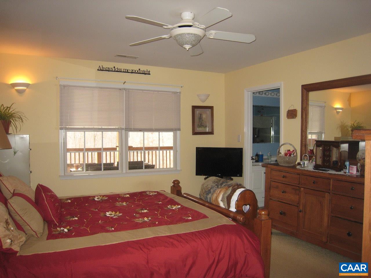 262 Pine Ridge Road Faber, VA 22938 - Photo 33 of 45 a bedroom with a bed and furniture with window
