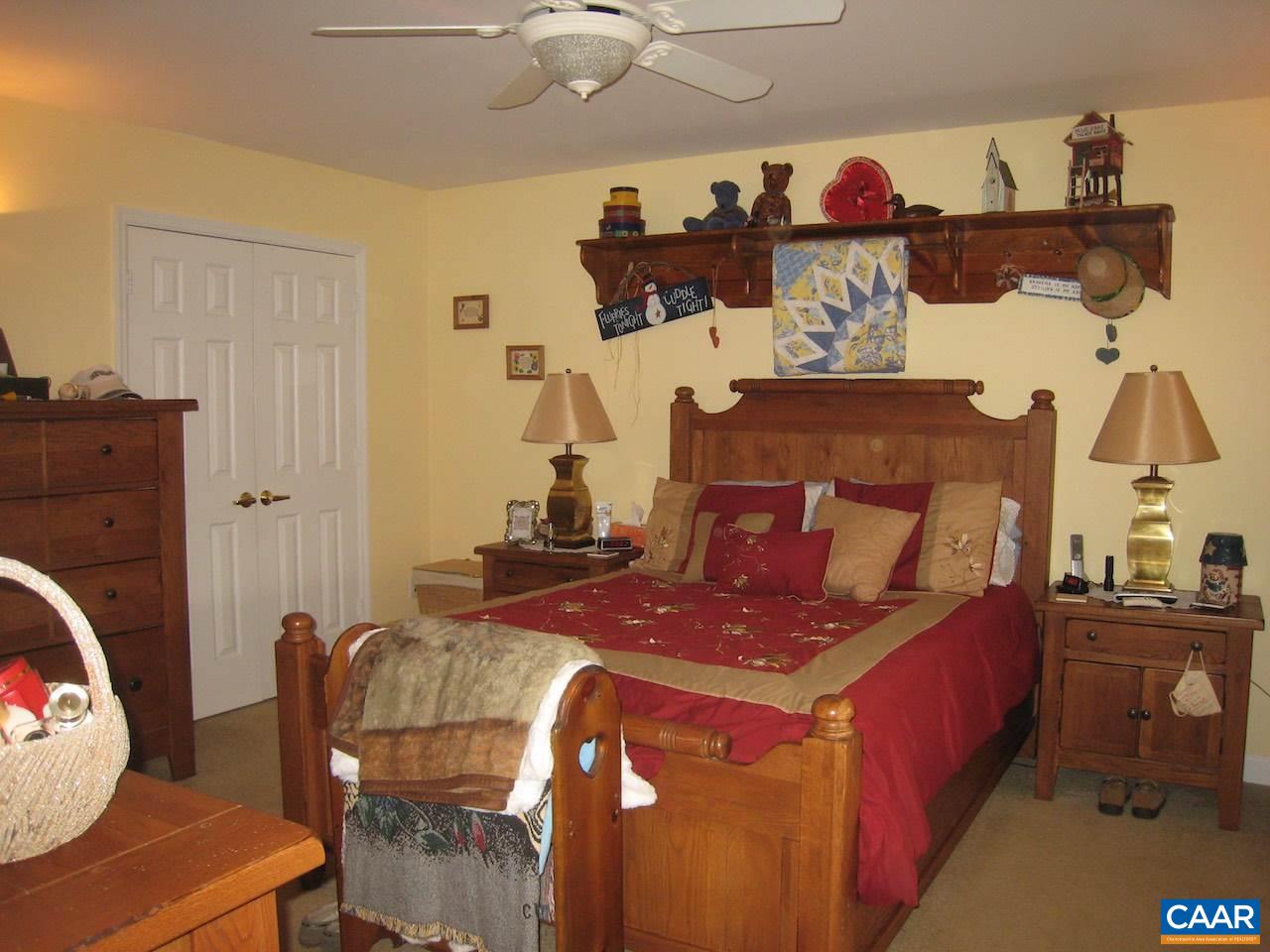 262 Pine Ridge Road Faber, VA 22938 - Photo 34 of 45 a bed room with a bed and a couch