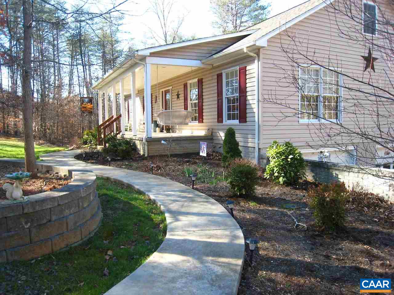262 Pine Ridge Road Faber, VA 22938 - Photo 5 of 45 a front view of a house with garden and patio