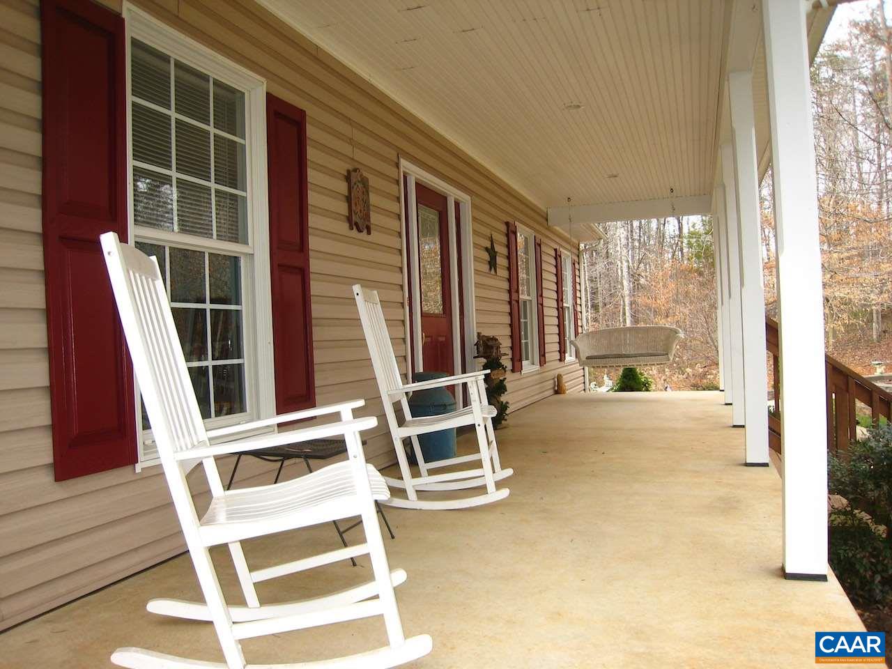 262 Pine Ridge Road Faber, VA 22938 - Photo 7 of 45 a view of a balcony with table and chairs