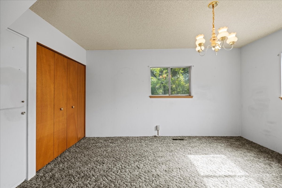 703 Washington Street Walla Walla, WA 99362 - Photo 11 of 30 a view of a chandelier in big room and a chandelier