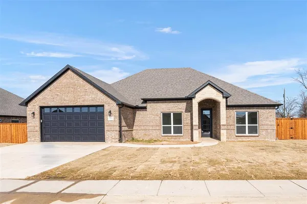 a front view of a house with a garage