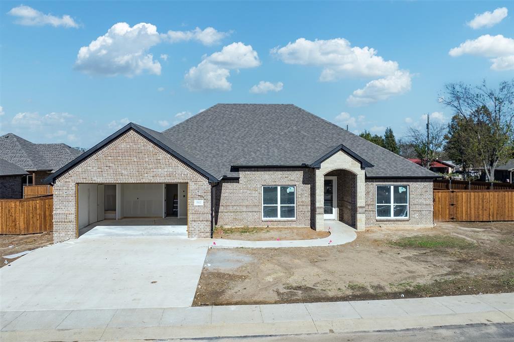 502 Limestone Circle Mabank, TX 75147 - Photo 1 of 11 a front view of a house with a yard and garage