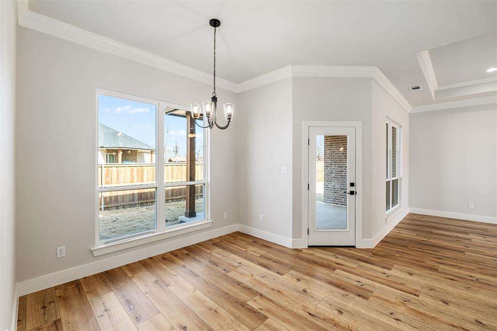 502 Limestone Circle Mabank, TX 75147 - Photo 12 of 38 a view of empty room with wooden floor and fan