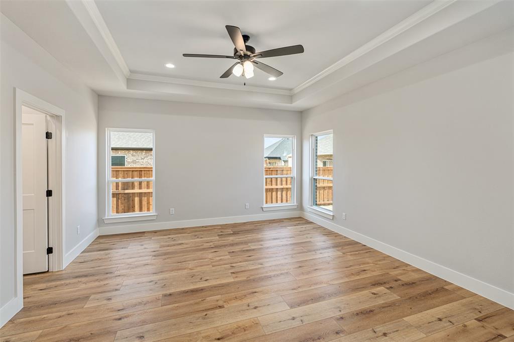 502 Limestone Circle Mabank, TX 75147 - Photo 14 of 38 wooden floor in an empty room with a window