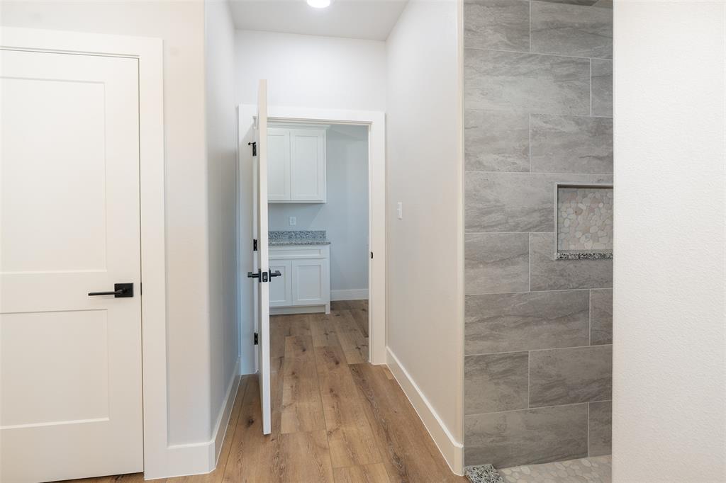 502 Limestone Circle Mabank, TX 75147 - Photo 17 of 38 a bathroom with a shower and a glass door