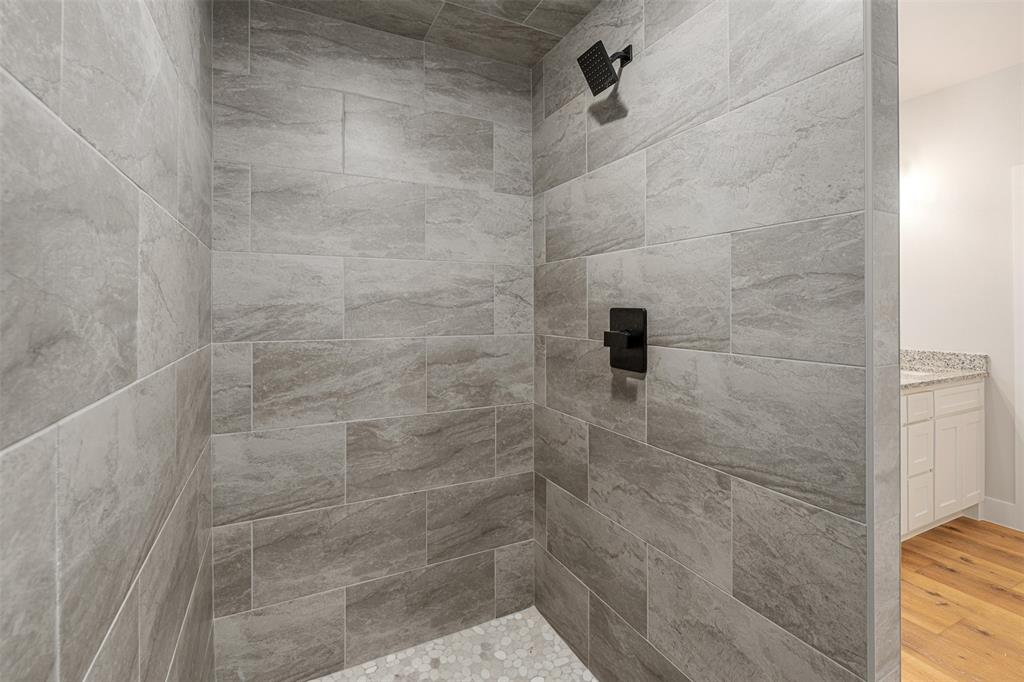 502 Limestone Circle Mabank, TX 75147 - Photo 18 of 38 a bathroom with a shower