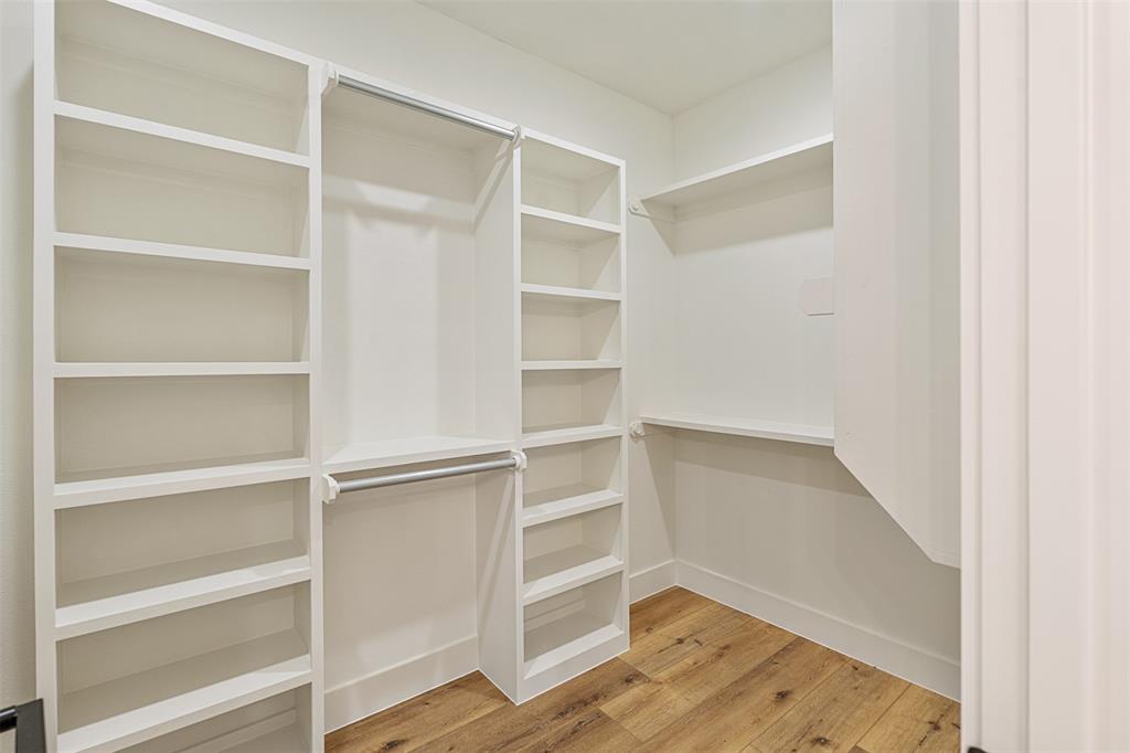 502 Limestone Circle Mabank, TX 75147 - Photo 19 of 38 a view of walk in closet with empty racks