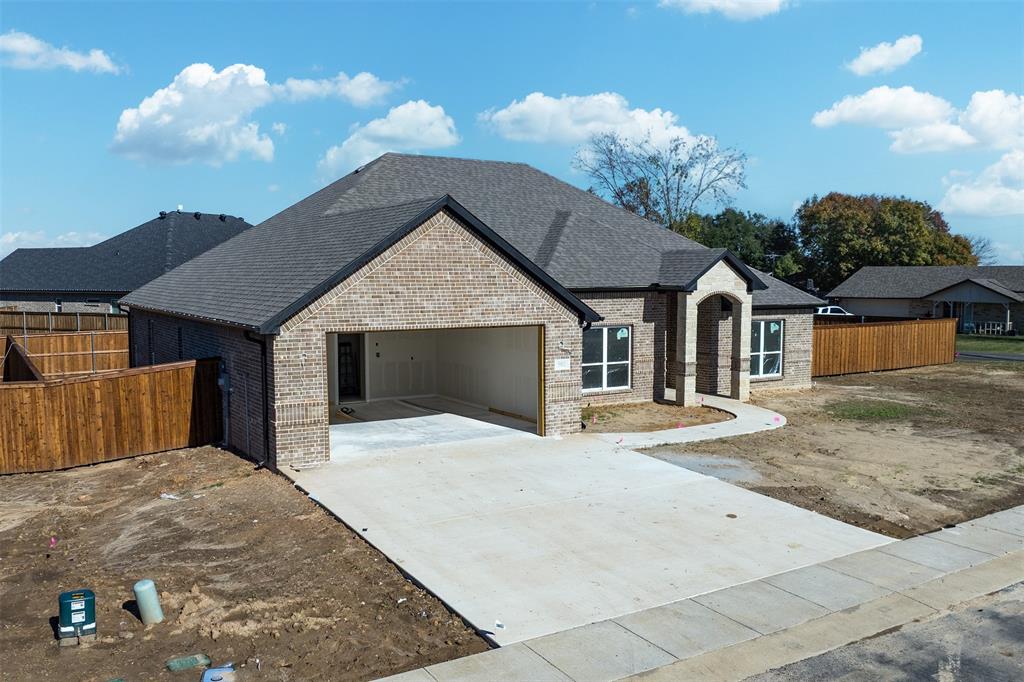 502 Limestone Circle Mabank, TX 75147 - Photo 2 of 11 a front view of a house with yard