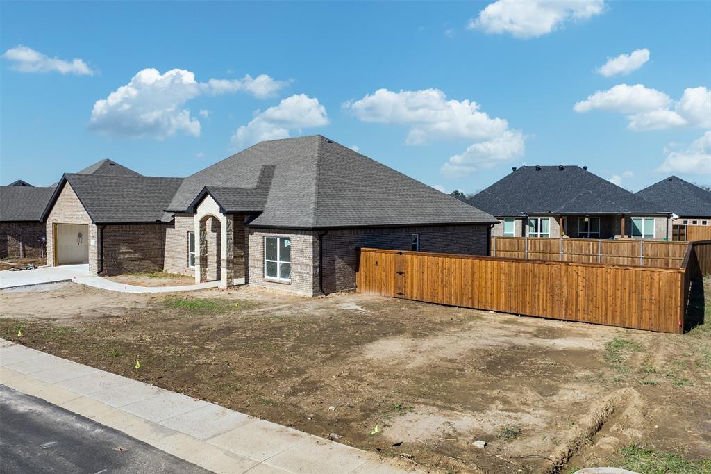 502 Limestone Circle Mabank, TX 75147 - Photo 3 of 11 a view of a house with a yard