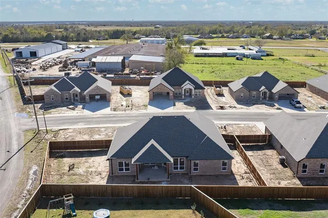 an aerial view of a house with a ocean view