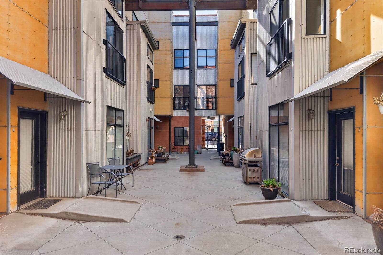 3225 Blake Street, Unit 20 Denver, CO 80205 - Photo 45 of 47 a view of a brick building with many windows