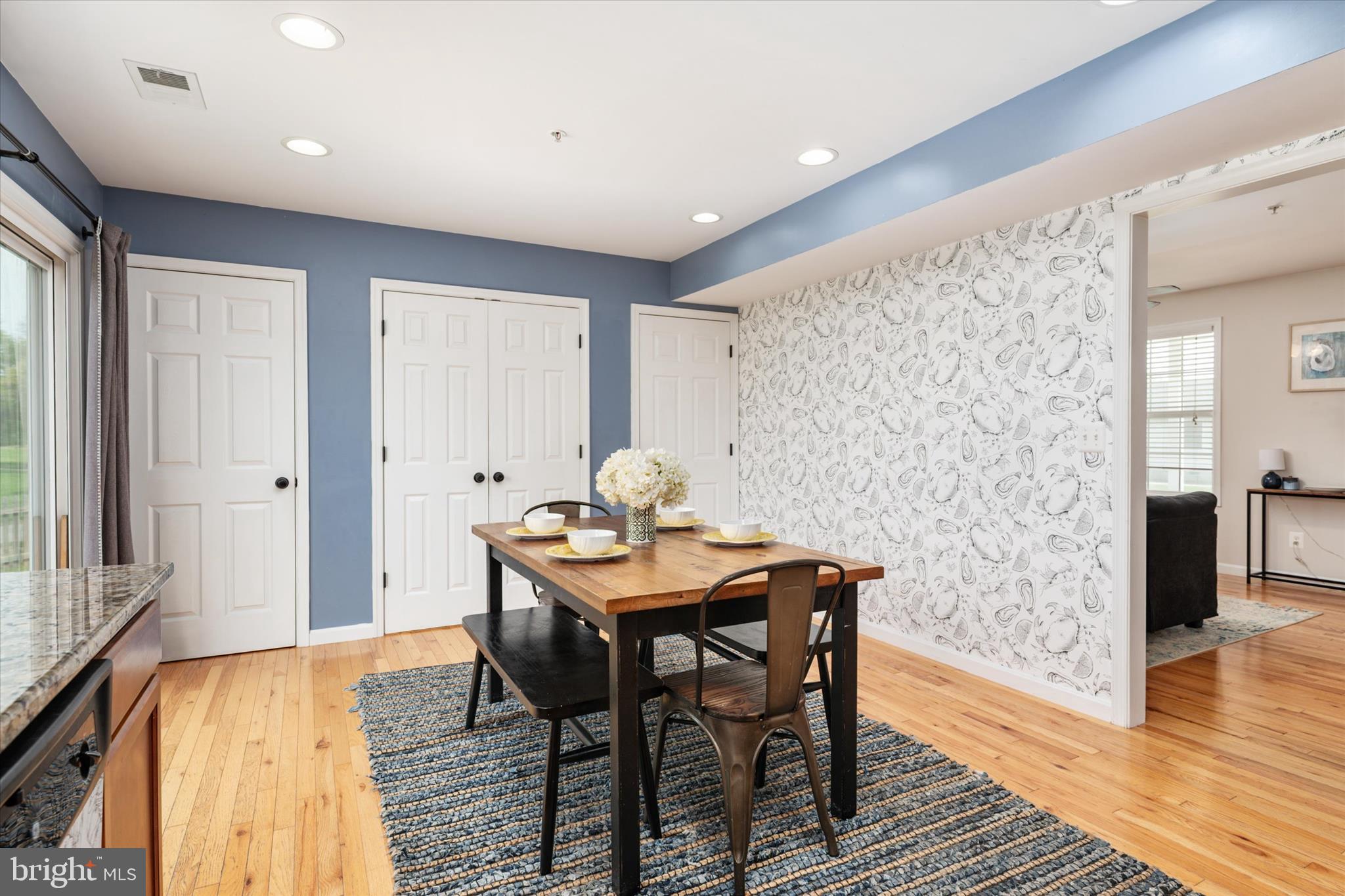 200 Newtown Road Chester, MD 21619 - Photo 18 of 50 a view of a dining room with furniture and wooden floor
