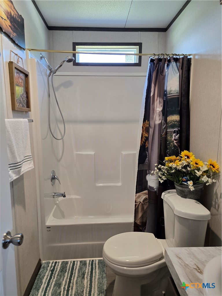 412 Coryell City Road Gatesville, TX 76528 - Photo 20 of 34 a bathroom with a sink toilet and shower