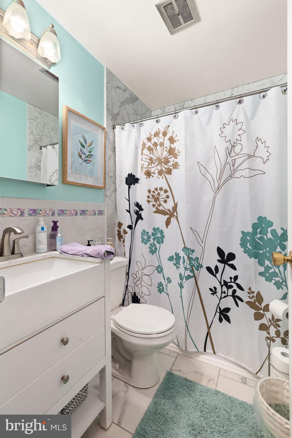 3409 Acton Road Parkville, MD 21234 - Photo 14 of 27 a bathroom with a sink toilet and shower