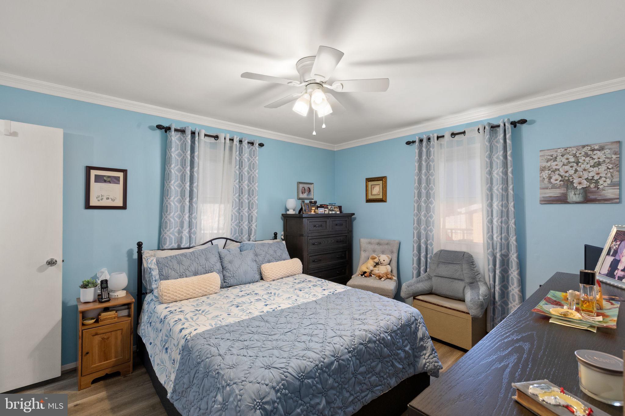 3409 Acton Road Parkville, MD 21234 - Photo 15 of 27 a bedroom with a bed and wooden floor