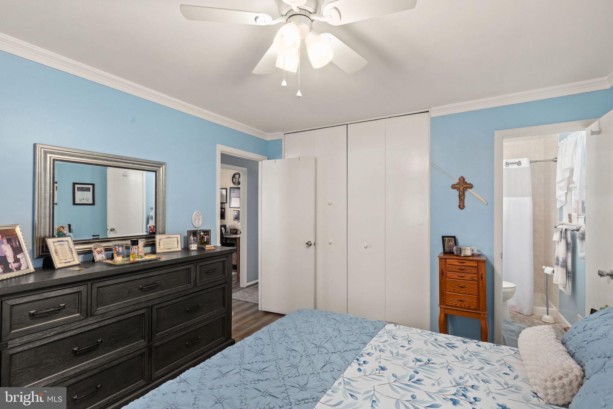 3409 Acton Road Parkville, MD 21234 - Photo 16 of 27 a bedroom with a bed and a dresser