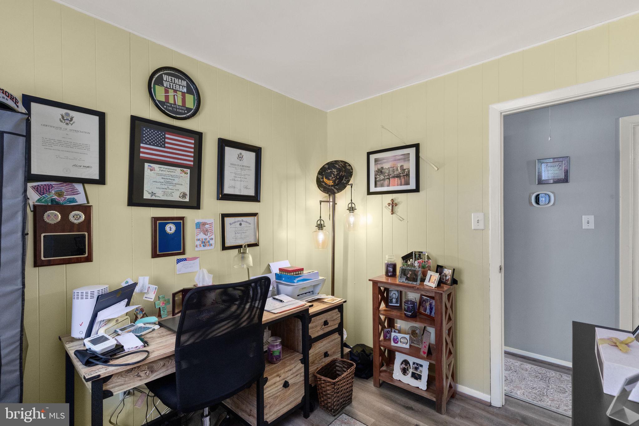 3409 Acton Road Parkville, MD 21234 - Photo 21 of 27 a bedroom with furniture and a bookshelf