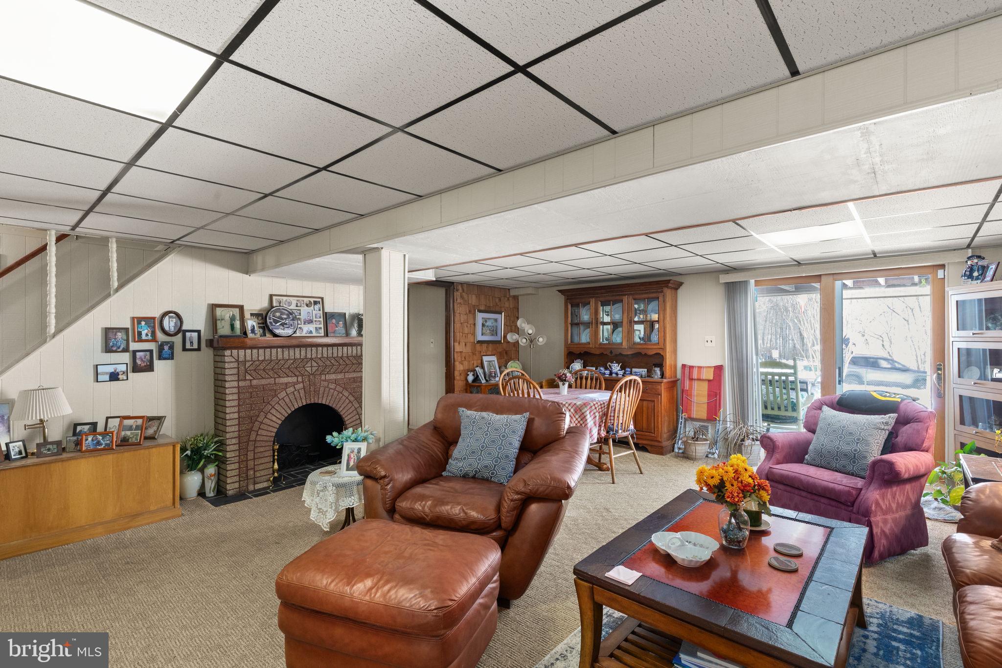 3409 Acton Road Parkville, MD 21234 - Photo 23 of 27 a living room with furniture and a fireplace