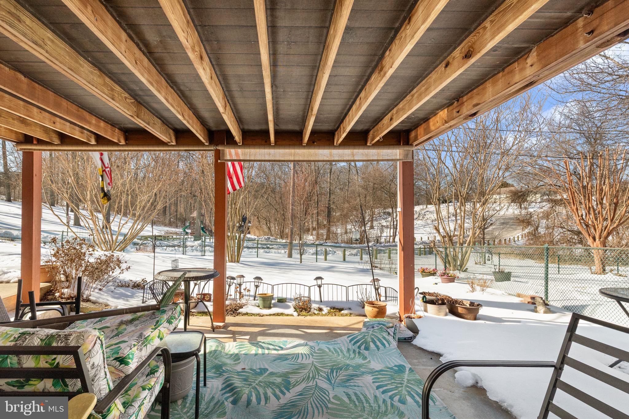 3409 Acton Road Parkville, MD 21234 - Photo 26 of 27 a outdoor space with patio lots of furniture and large windows