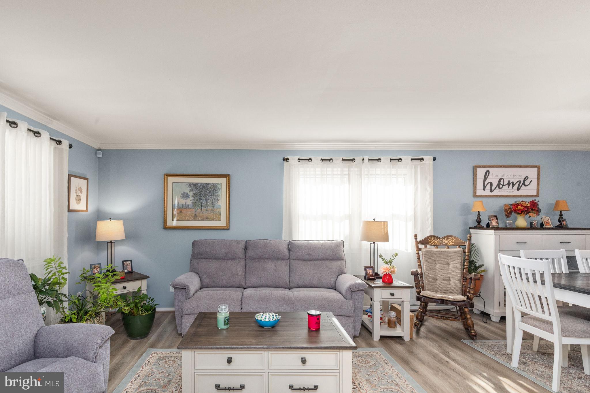 3409 Acton Road Parkville, MD 21234 - Photo 3 of 27 a living room with furniture and flowers