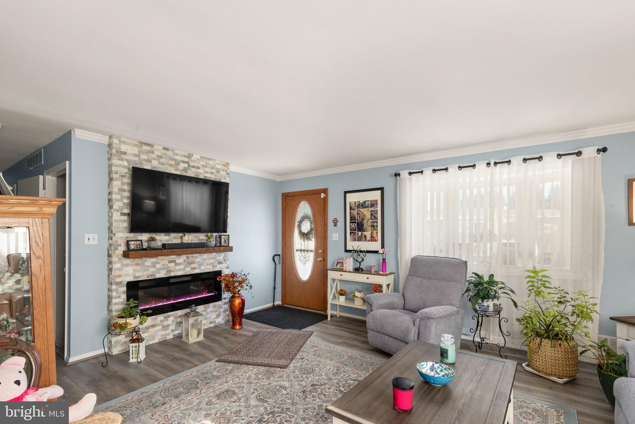3409 Acton Road Parkville, MD 21234 - Photo 4 of 27 a living room with furniture and a flat screen tv