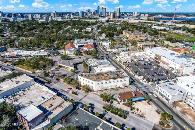 an aerial view of residential houses and outdoor space