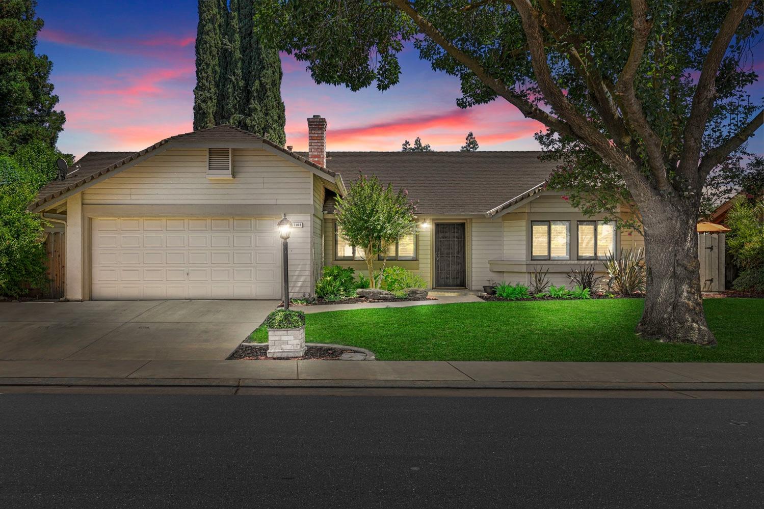 3108 Harbor Drive Modesto, CA 95355 - Photo 1 of 1 a front view of a house with a yard and garage