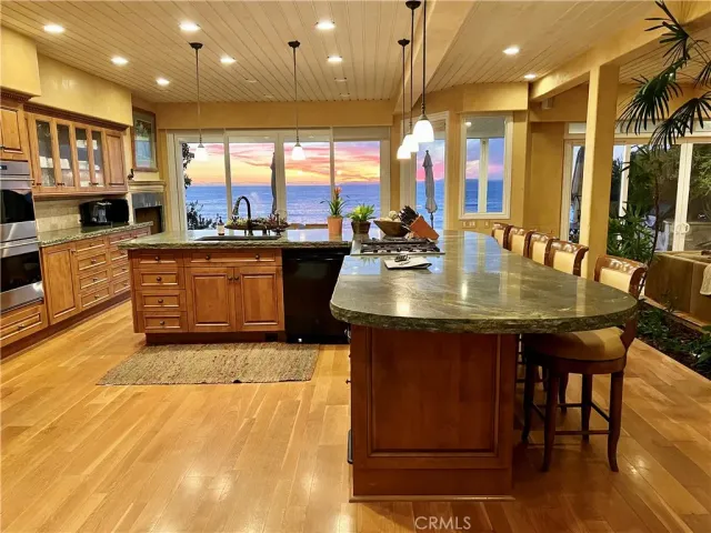 a view of a living room and kitchen