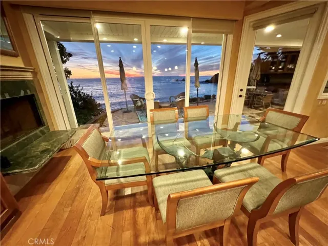 a view of a living room with furniture and floor to ceiling windows