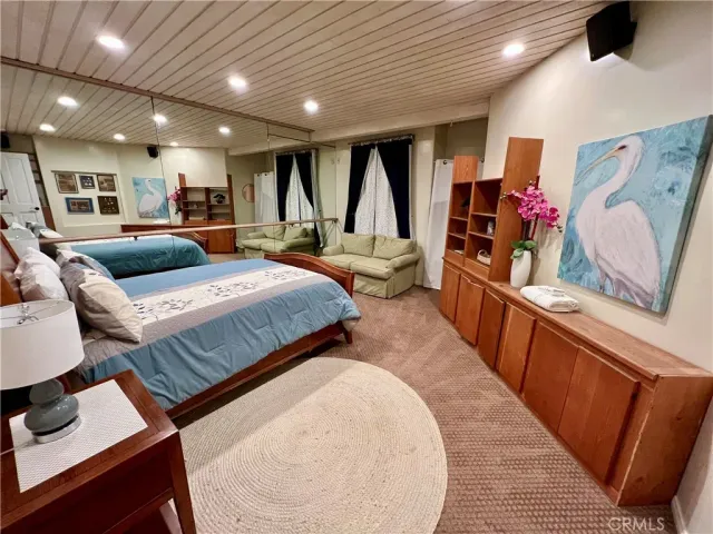 a living room with furniture and chairs