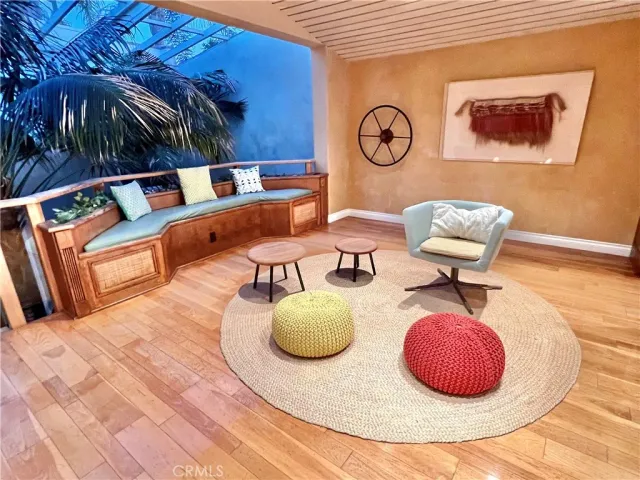 a living room with fireplace furniture and a flat screen tv