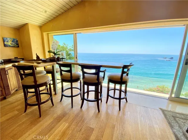 a living room with a fireplace furniture and a large window