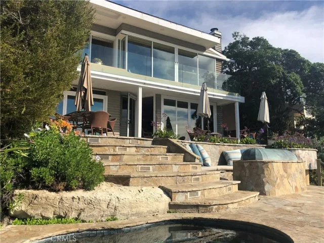 a view of a backyard of the house