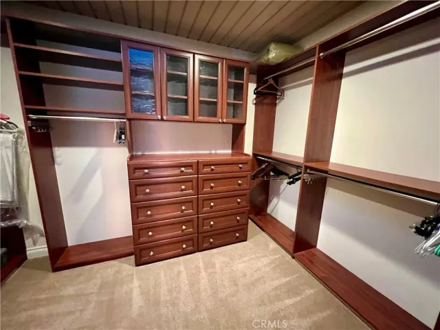 a spacious bedroom with a bed and couch