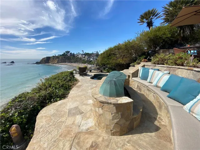 an outdoor space with furniture and umbrella
