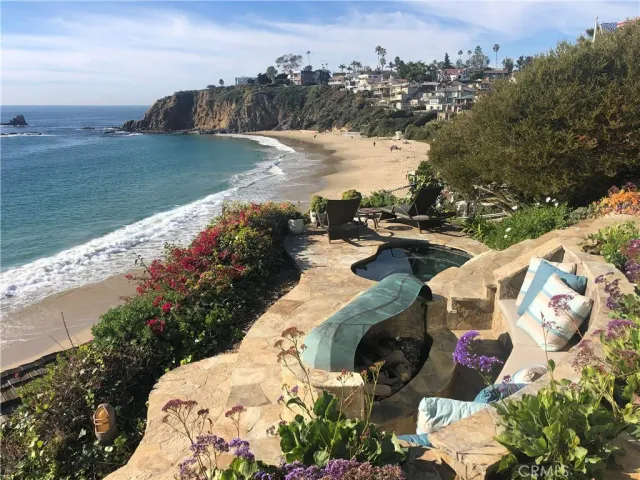 a large kitchen with stainless steel appliances granite countertop a lot of counter space and a sink
