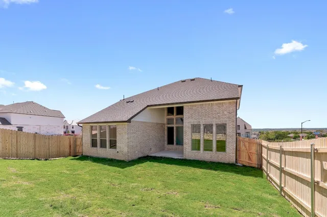 a view of a back yard of the house