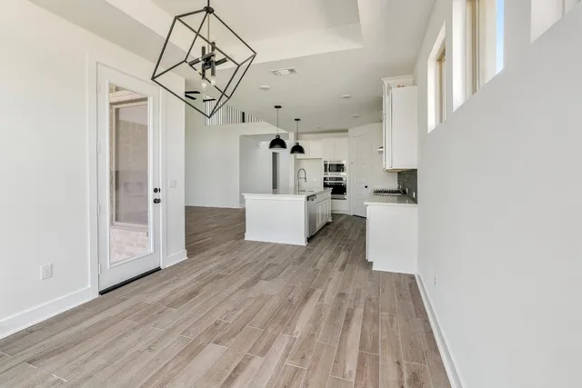 a view of a livingroom with wooden floor